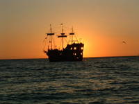 Sunset behind the Jolly Roger.